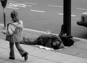 1024px-Man_sleeping_on_Canadian_sidewalk